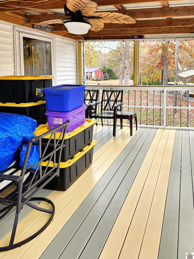 wooden terrace featuring ceiling fan