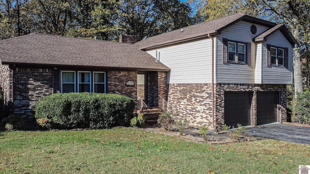 view of front of home featuring a garage and a front lawn