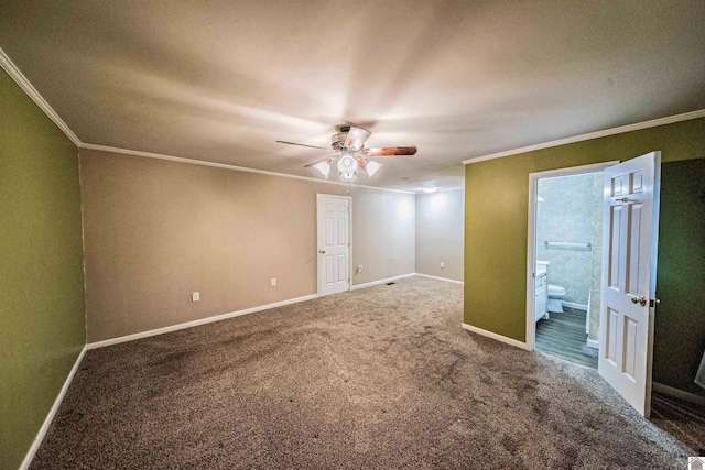 spare room with ceiling fan, carpet flooring, and crown molding