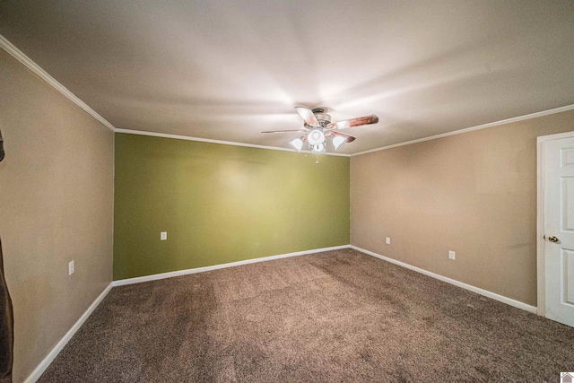 carpeted empty room featuring ornamental molding and ceiling fan