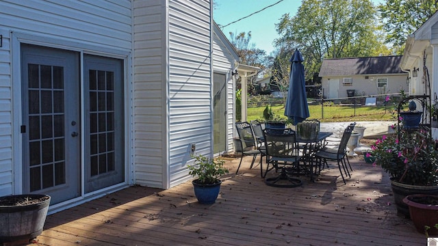 wooden deck featuring french doors