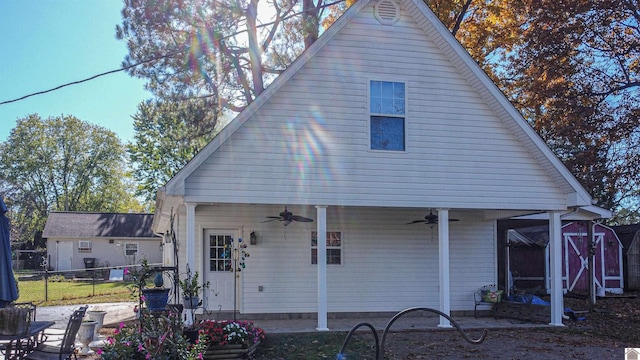 rear view of house featuring ceiling fan