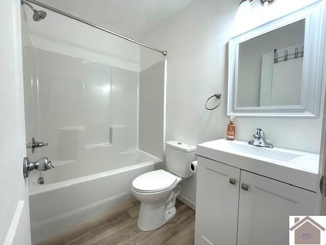 full bathroom with hardwood / wood-style floors, vanity, toilet, and bathtub / shower combination