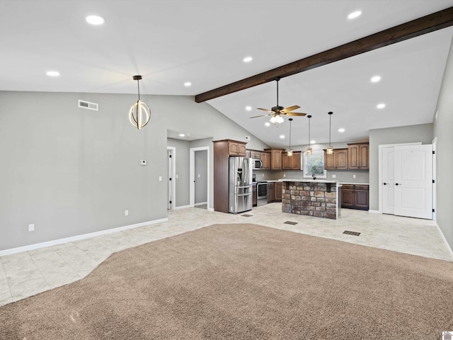 unfurnished living room with ceiling fan, sink, light carpet, and vaulted ceiling with beams