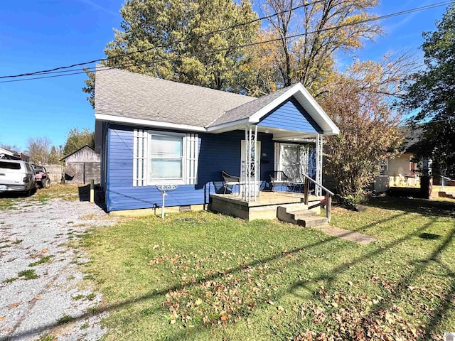 bungalow-style home featuring a front lawn