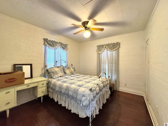 bedroom featuring ceiling fan and dark hardwood / wood-style floors