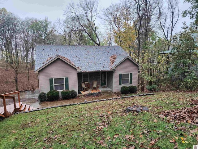 ranch-style home with a patio area and a front lawn