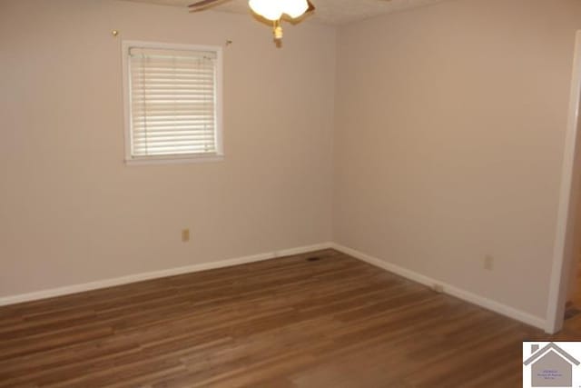 unfurnished room featuring ceiling fan and dark hardwood / wood-style flooring