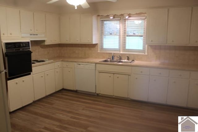 kitchen featuring sink, white cabinets, extractor fan, and white appliances