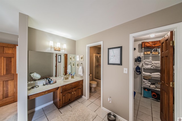 full bathroom featuring tile patterned flooring, vanity, toilet, and enclosed tub / shower combo