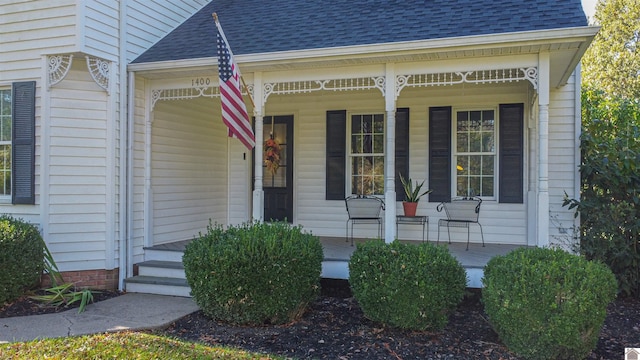 doorway to property with a porch