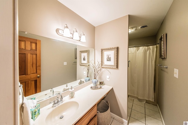 bathroom with tile patterned flooring, vanity, and curtained shower