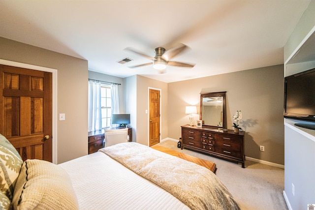 bedroom featuring light colored carpet and ceiling fan