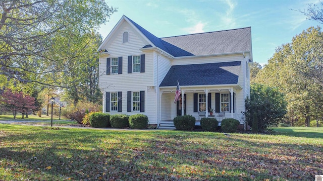 view of front of home with a porch and a front lawn