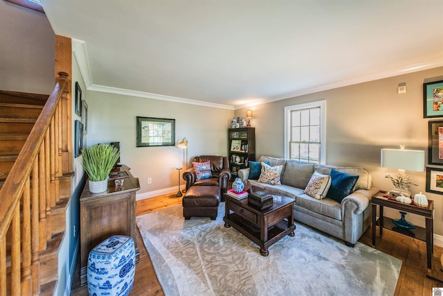 living room featuring hardwood / wood-style flooring and crown molding