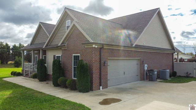 view of property exterior featuring a garage and central air condition unit