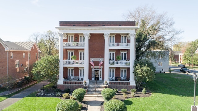 333 N 7th St Unit B, Paducah, KY 42001 - view of front of house featuring a balcony, french doors, a front lawn, a porch, and brick siding