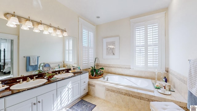 333 N 7th St Unit B, Paducah, KY 42001 - full bathroom with a garden tub, double vanity, a sink, and tile patterned floors