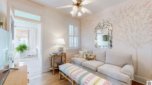 333 N 7th St Unit B, Paducah, KY 42001 - living room with wood finished floors, ceiling fan, wallpapered walls, and baseboards
