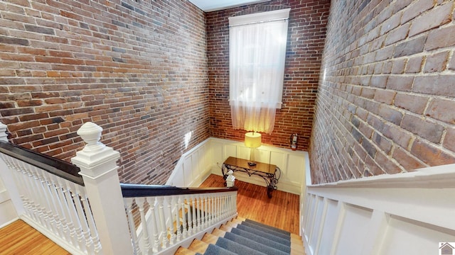 333 N 7th St Unit B, Paducah, KY 42001 - stairway featuring wood finished floors and brick wall