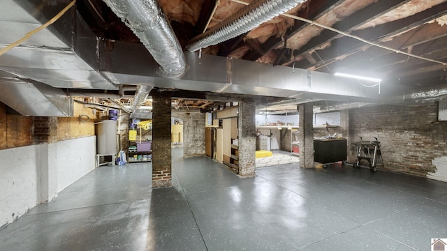 333 N 7th St Unit B, Paducah, KY 42001 - unfinished basement with water heater and brick wall
