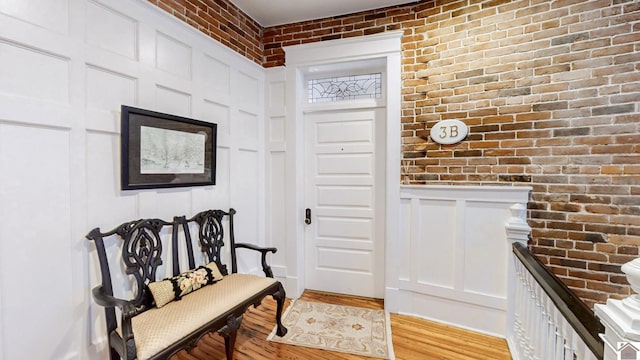 333 N 7th St Unit B, Paducah, KY 42001 - entrance foyer featuring light wood-style flooring and brick wall