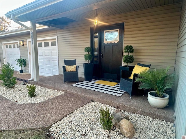 view of exterior entry with a garage