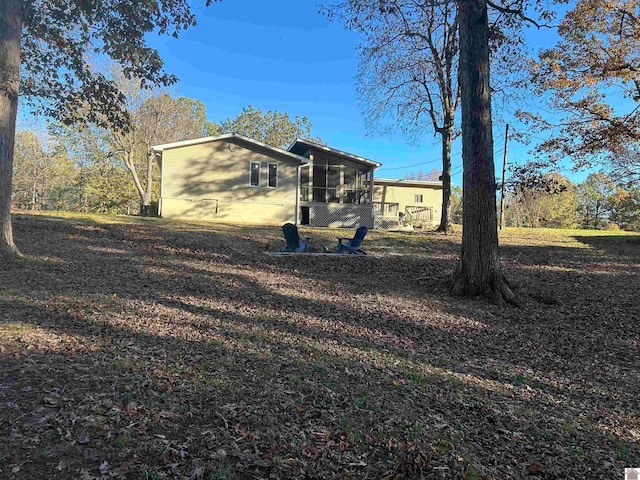 view of side of property featuring a sunroom