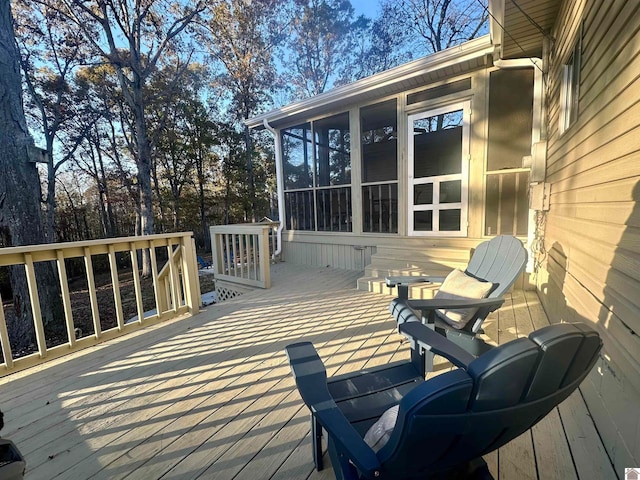 wooden deck featuring a sunroom