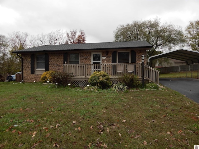 single story home with a front lawn and a carport