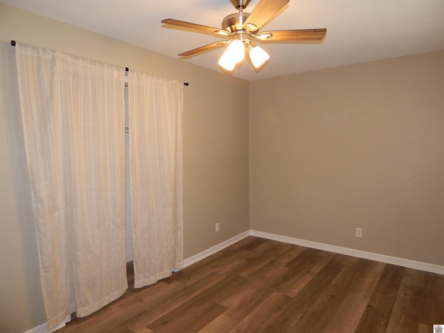 unfurnished room featuring ceiling fan and dark wood-type flooring