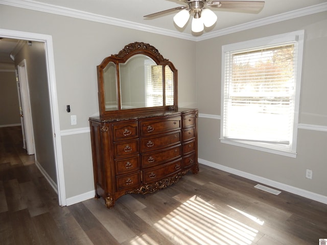 bedroom with ceiling fan, dark wood-type flooring, and ornamental molding