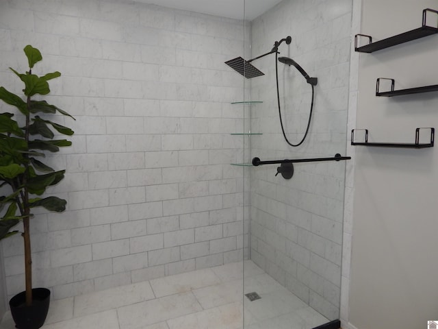 bathroom with a tile shower