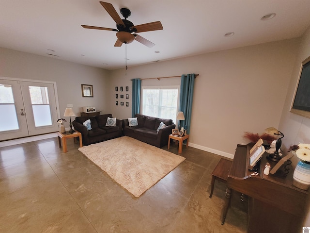 living room featuring french doors and ceiling fan