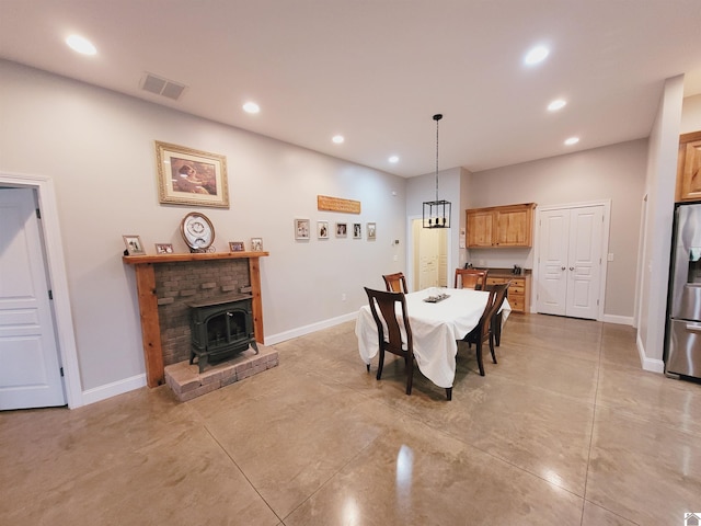 dining room with a wood stove