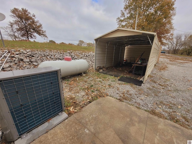 exterior space featuring ac unit and a carport