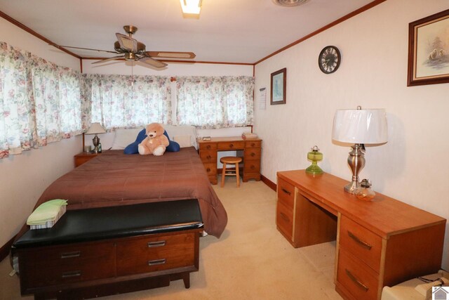 carpeted bedroom with crown molding and ceiling fan