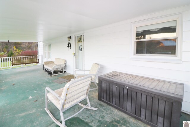 wooden terrace featuring covered porch