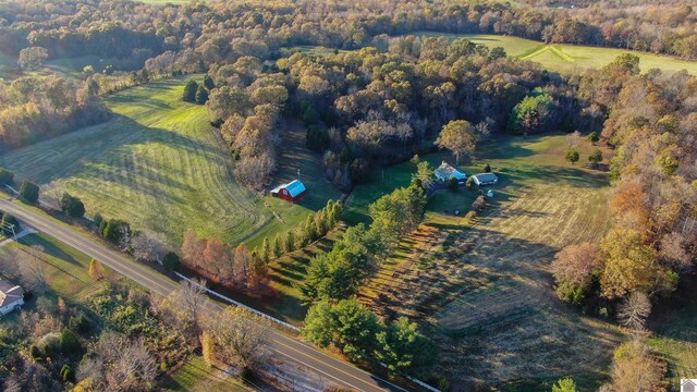 birds eye view of property featuring a rural view