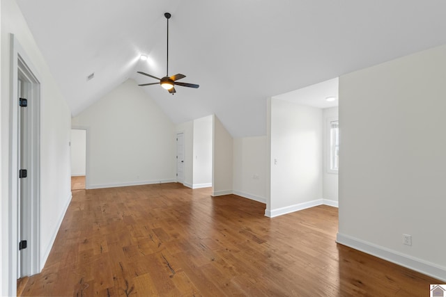 bonus room with ceiling fan, wood-type flooring, and vaulted ceiling