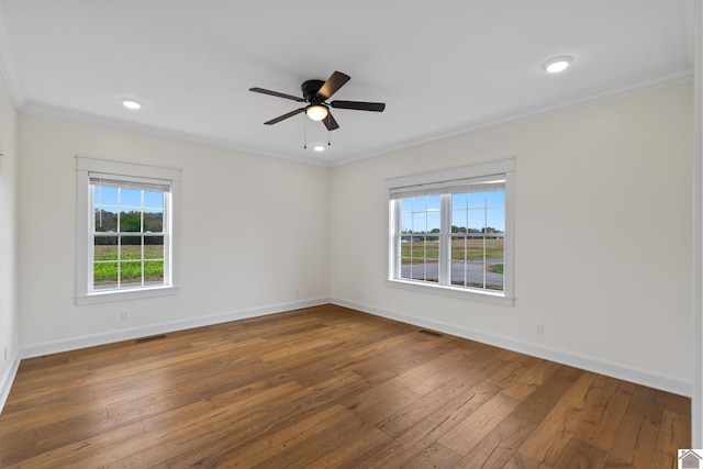 spare room with ceiling fan, hardwood / wood-style floors, and ornamental molding