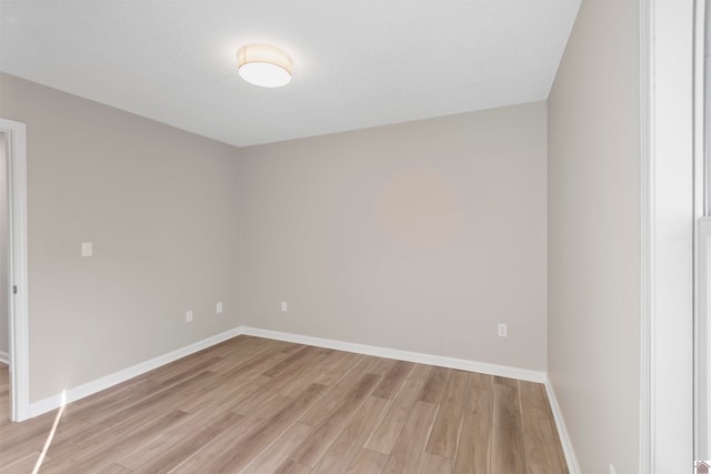 unfurnished room featuring light wood-type flooring