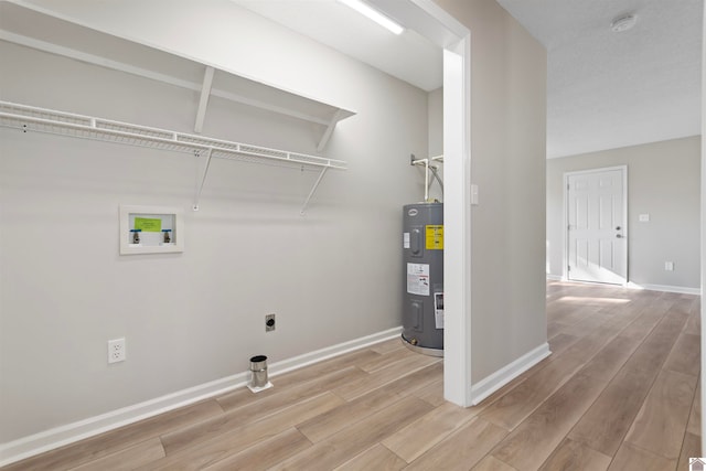 washroom featuring washer hookup, hookup for an electric dryer, and electric water heater