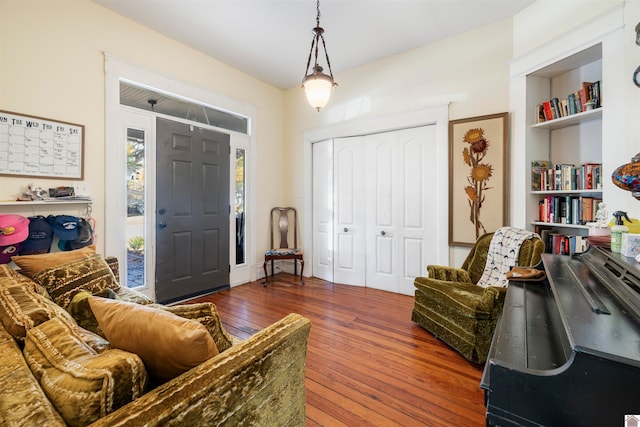 sitting room with hardwood / wood-style flooring