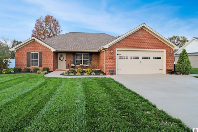 single story home featuring a garage and a front lawn