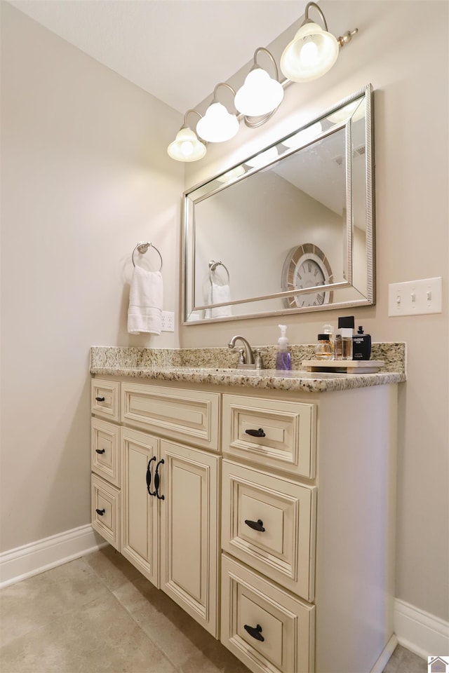 bathroom with tile patterned flooring and vanity