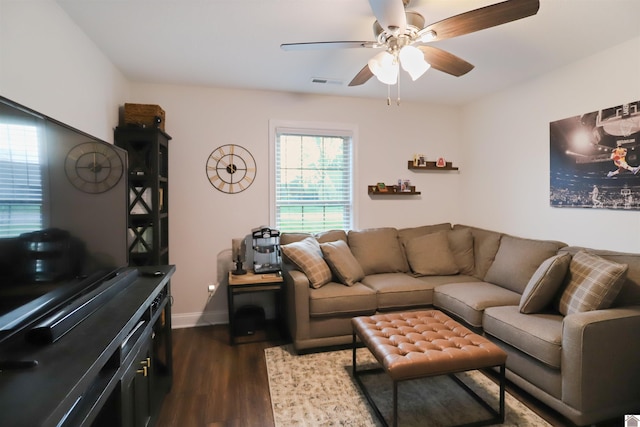 living room featuring hardwood / wood-style floors and ceiling fan