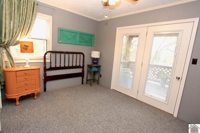 carpeted bedroom with access to outside, french doors, ceiling fan, ornamental molding, and a textured ceiling