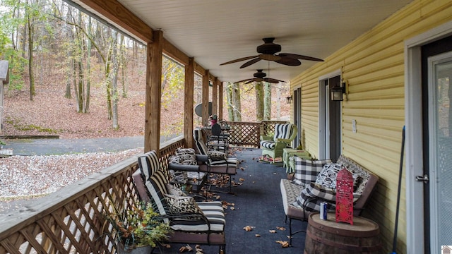 view of patio with ceiling fan and a porch