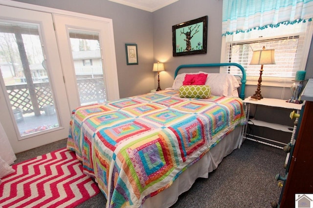 carpeted bedroom featuring ornamental molding